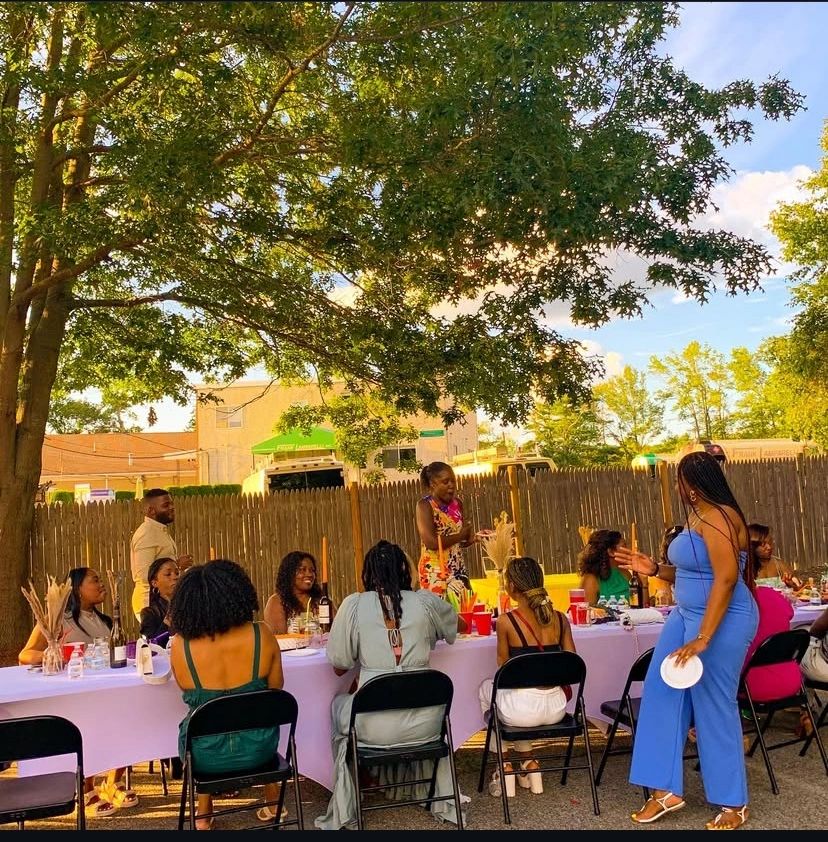 Adults gathered for a community dinner