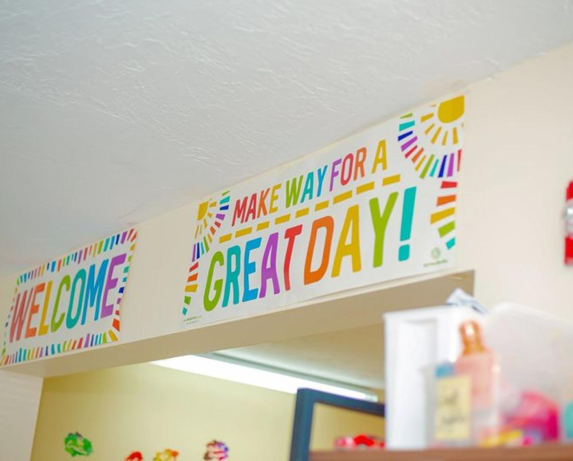 A bright classroom wall welcoming children to a great day