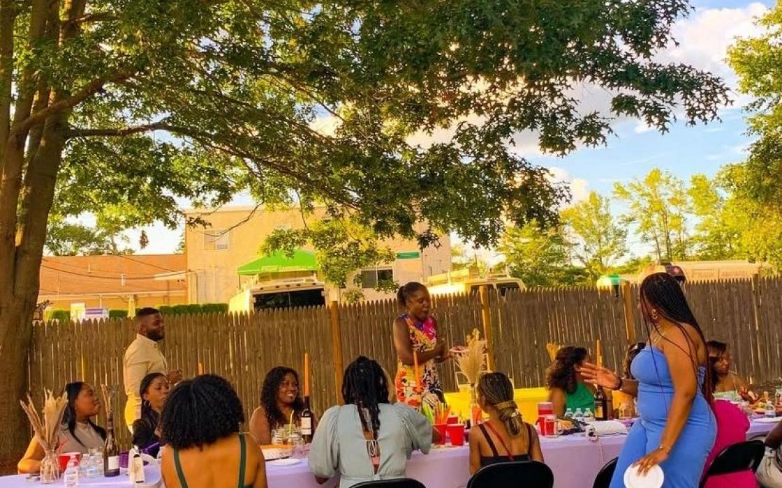 Adults gathered for a community dinner