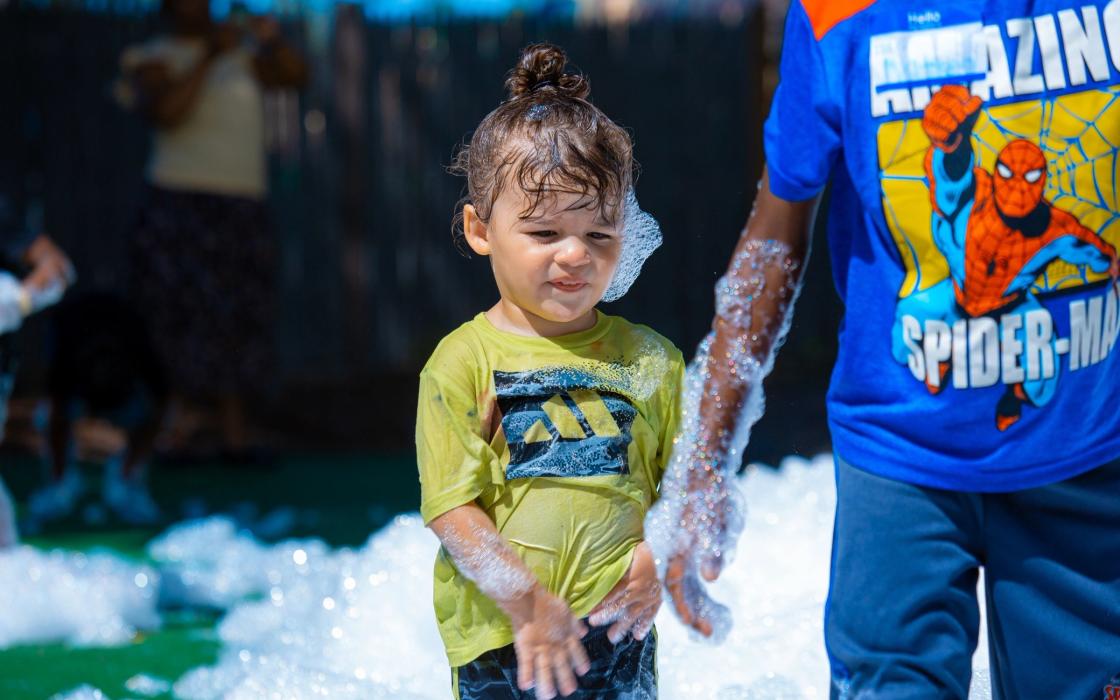 A child in costume at the foam party