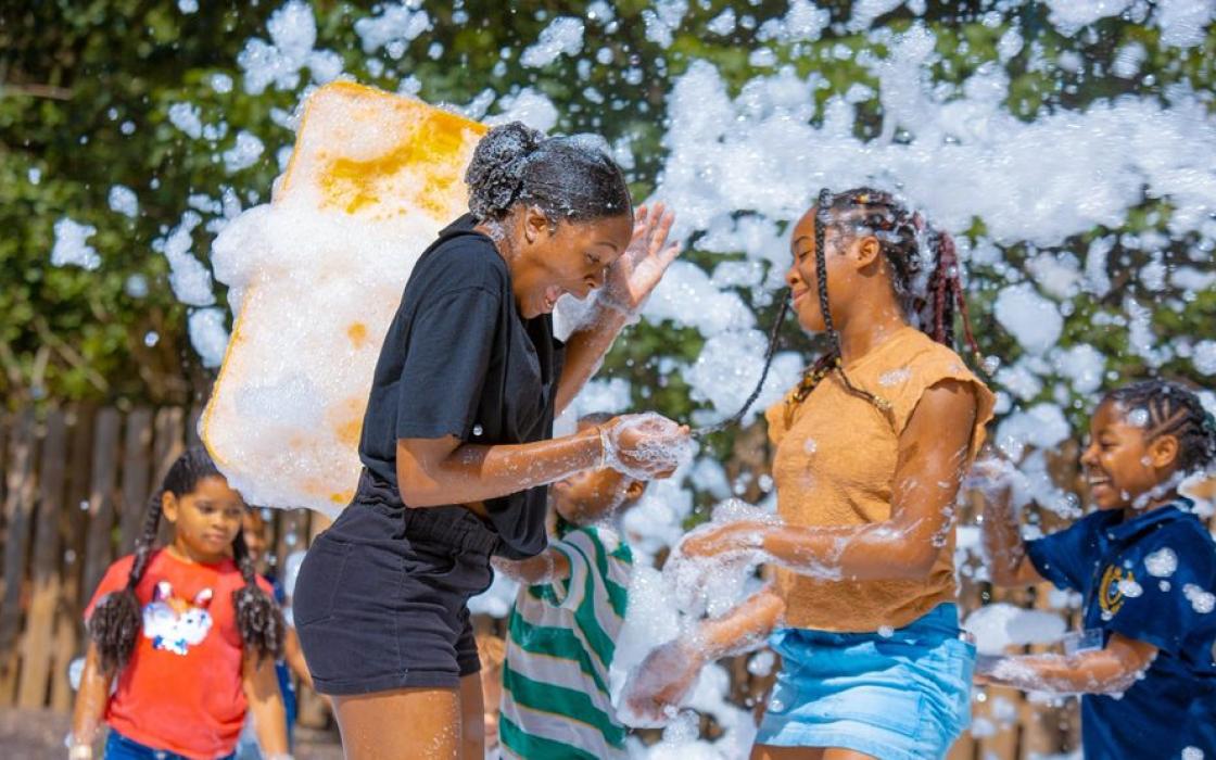 Families and children enjoying the foam party together