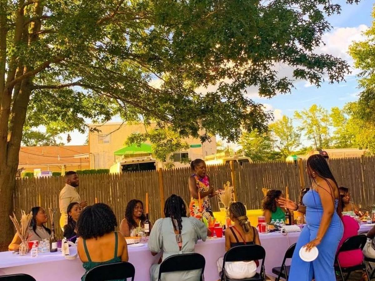 Adults gathered for a community dinner